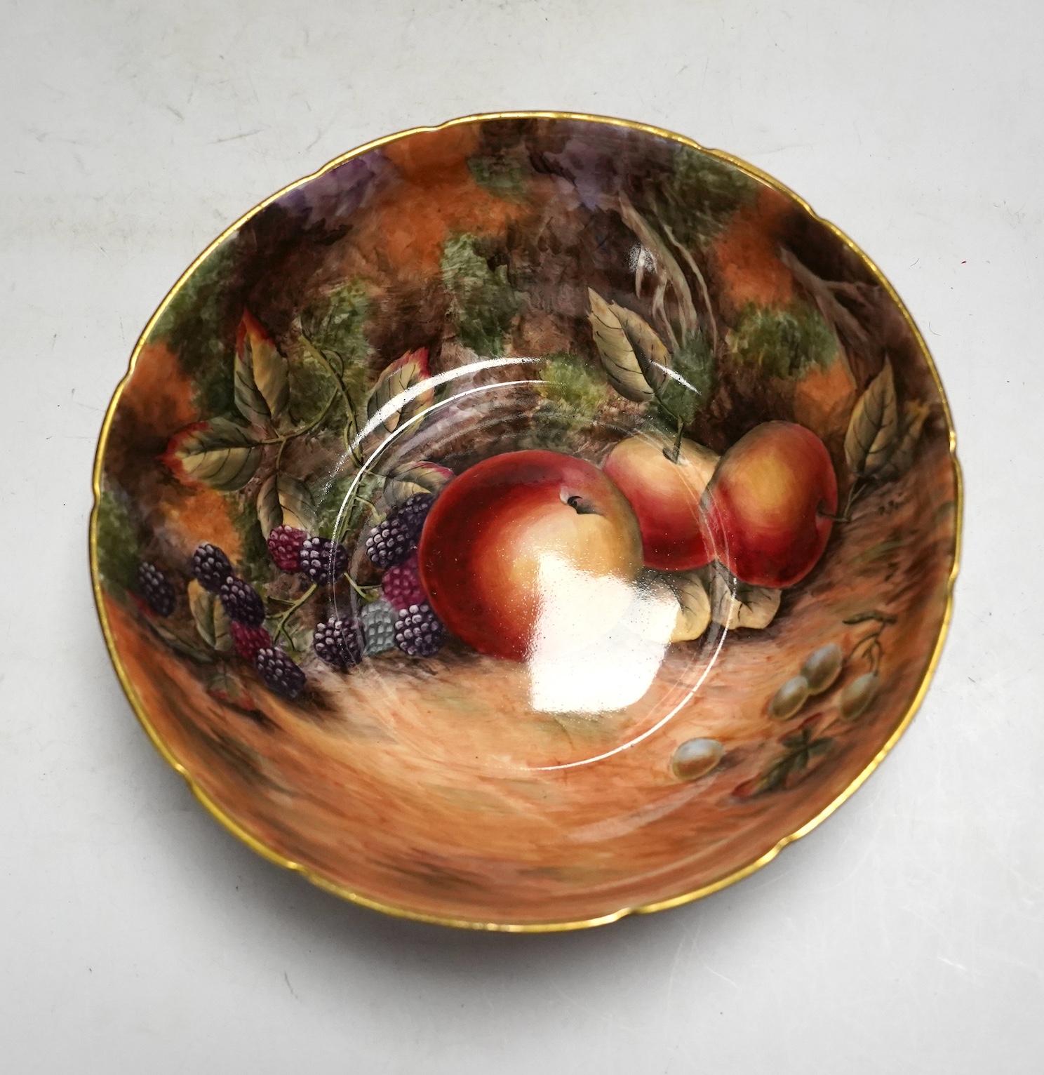 A tea set painted with still life of fruit, Studio D.R.B., comprising six cups and saucers, two bowls and two plates